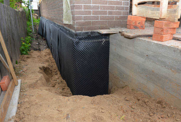 Happy homeowners after waterproofing job in Drayden